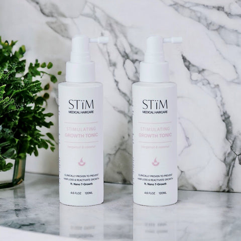 Stïm Haircare Stimulating Growth Tonïc Duo bundle with two bottles of hair growth treatment, featuring natural ingredients and applicator tips.