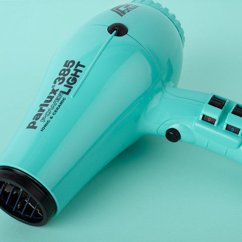 Parlux 385 Ionic Hair Dryer with 2150W power, featuring black and silver design, ergonomic handle, and concentrator nozzle.