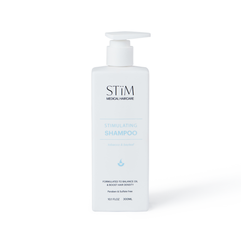 Stïm Haircare stimulating shampoo bottle with sleek design and label, ideal for scalp and hair revitalization.
