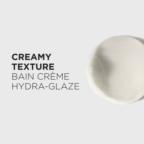 Kérastase Gloss Absolu Bain Crème Hydra-Glaze shampoo bottle, 250mL, with sleek design and product label visible.