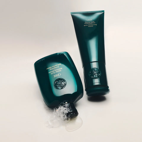 Oribe Eternal Curls Intense Conditioner in 200ml bottle, designed for curly hair, with a sleek white packaging and pump dispenser.
