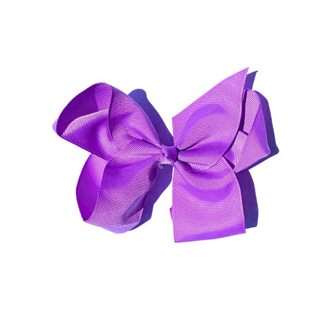 Six-inch hair bows with clips in 24 colors, styled for girls, featuring the Perfect Pony Hair brand hair accessories.