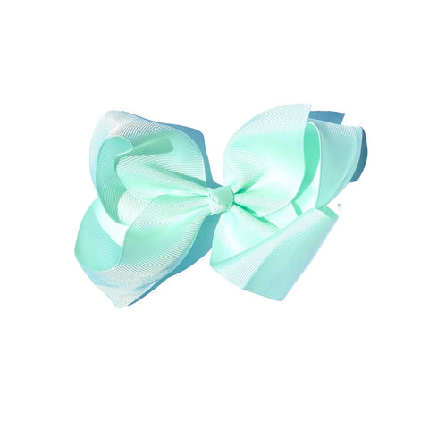 Six-inch Perfect Pony Hair Bows with clips in 24 vibrant colors, ideal hair accessories for children and adults.