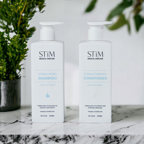 Stïm Haircare Shower Duo bundle with shampoo and conditioner bottles, sleek packaging, and label details visible.