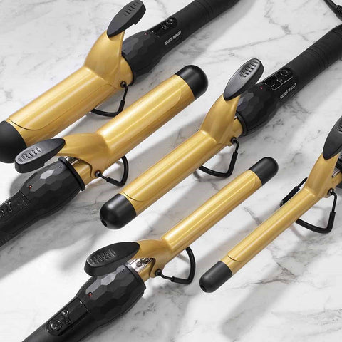 Silver Bullet Fastlane Curl gold 25mm hair curler with a sleek design, featuring a silver and gold finish and a heat barrel for curling hair.