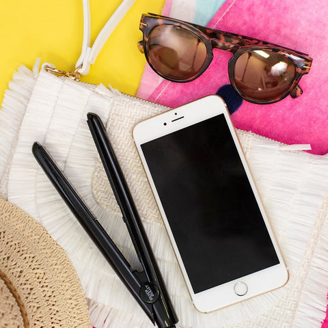 Silver Bullet Mini Straightener with sleek silver design, compact hair straightener for quick styling and easy handling.