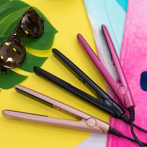 Silver Bullet Mini Straightener with sleek design, showing textured ceramic plates for smooth hair styling.