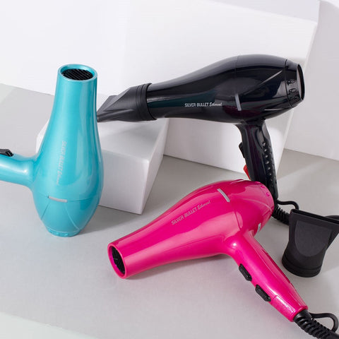 Silver Bullet Ethereal Dryer 2000W hair dryer with a sleek silver finish, featuring multiple heat and speed settings.