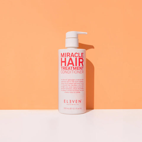 Eleven Australia Miracle Hair Treatment Conditioner in 300ml bottle, smooth and nourishing for healthy hair, close-up shot.