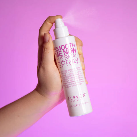 Eleven Australia Smooth Me Now thermal spray for blow-drying, 200ml bottle with spray nozzle, smooths and protects hair during styling.