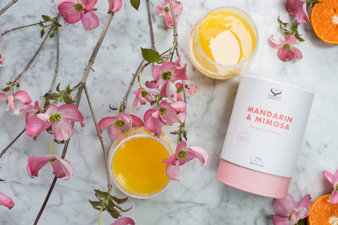 Skindles Mandarin & Mimosa scented candle in a 250g jar, featuring a warm glow and fresh citrus and floral fragrance.
