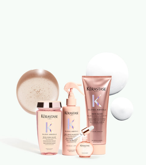Kérastase Absolu Gloss bundle featuring the complete line of hair gloss products with sleek packaging and textured bottles.