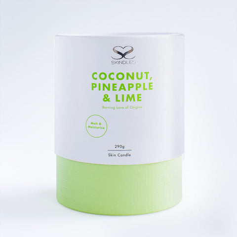 Skindles coconut, pineapple, and lime scented candle in 290g glass jar with tropical fruit design.