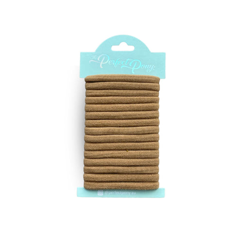 Damage-free soft hair elastics from Perfect Pony Hair in neutral colors, 15-pack, gentle on hair and ideal for everyday styling.