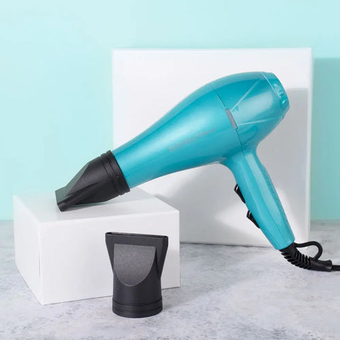 Silver Bullet Ethereal Dryer 2000W hair dryer with sleek silver finish and multiple nozzle attachments, shown in a close-up image.