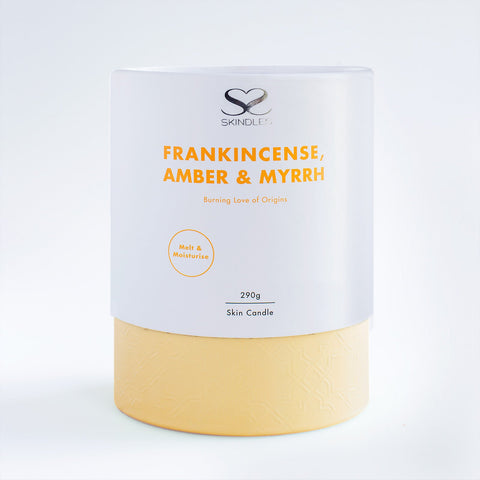 Skindles frankincense and myrrh scented candle with a natural wax finish, designed for relaxing ambiance and aromatic appeal.