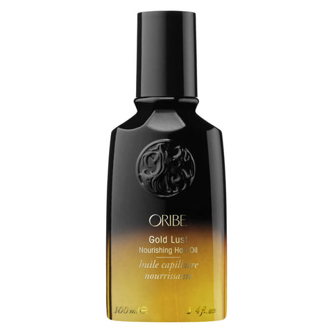Oribe Gold Lust nourishing hair oil, shampoo, and conditioner bundle, featuring luxurious hair care products in elegant packaging.