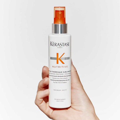 Kérastase Nutritive Lotion Thermique Sublimatrice leave-in treatment applied to hair, 150ml bottle, smooth and nourish hair strands.