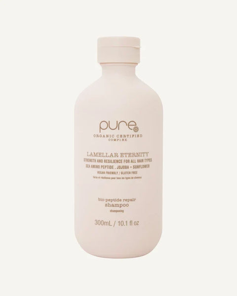 Pure Lamellar Eternity Shampoo 300ml bottle showing the sleek white and blue packaging with the label visible.