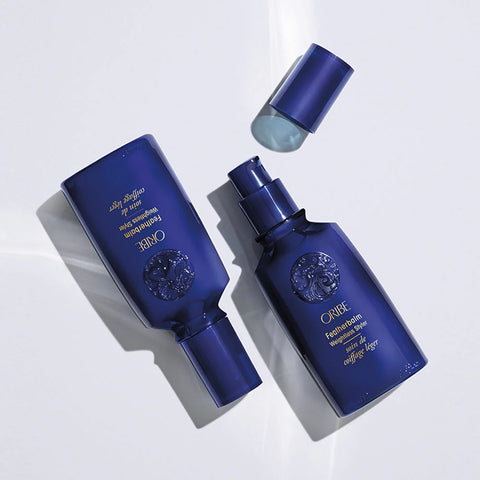 Oribe Featherbalm Weightless Styler bottle, 100ml, in a sleek container for lightweight hair styling and smooth finishes.