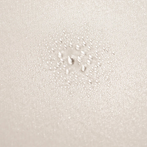 Oribe Serene Scalp Densifying Treatment Spray bottle showing the 125ml size and sleek design for scalp health.