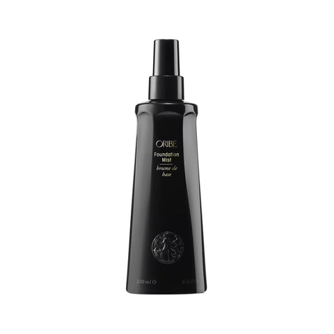 Oribe Foundation Mist styling spray in a sleek bottle, designed to enhance and set hair with a lightweight finishing touch.