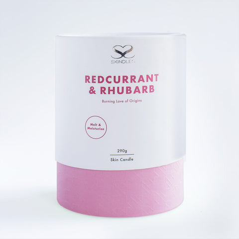 Scented Skindles candle in Redcurrant & Rhubarb 250g with vibrant red and pink wax, highlighting fresh fruit and floral design.