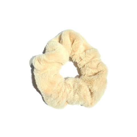 Soft, fluffy scrunchies from Perfect Pony Hair, showing three pastel-colored hair accessories with a plush, cozy texture.