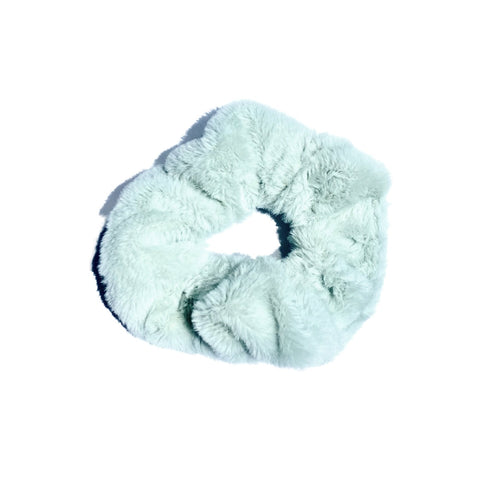Close-up of soft, fluffy scrunchies from Perfect Pony Hair, showcasing their plush texture and vibrant colors for hair accessories.