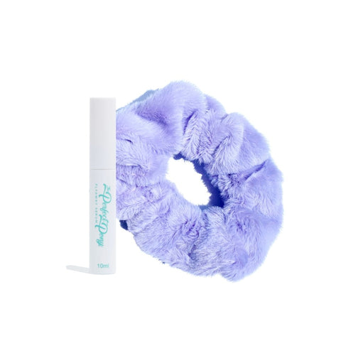 Soft, fluffy scrunchies and flyaway serum from Perfect Pony Hair, shown in a close-up of the hair accessories on a neutral background.