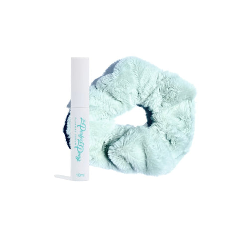 Super soft fluffy hair scrunchies and flyaway serum from Perfect Pony Hair, shown on a model's hair for smooth, voluminous style.