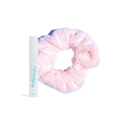 Pair of super soft fluffy hair scrunchies and a bottle of flyaway serum from Perfect Pony Hair, perfect for smooth, stylish hair.