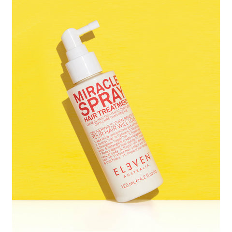 Eleven Australia Miracle Spray Hair Treatment in 125ml bottle, yellow packaging, designed to nourish and repair hair.