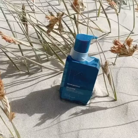 Kevin Murphy Re.Store treatment bottle in 200ml size, featuring sleek packaging and pump dispenser.