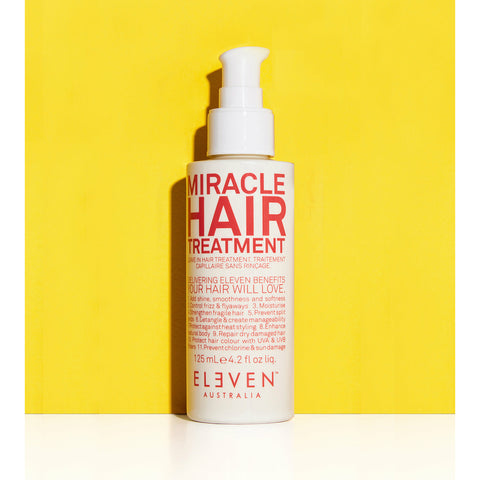 Bottle of Eleven Australia Miracle Hair Treatment 125ml with yellow packaging, designed to nourish and strengthen hair.