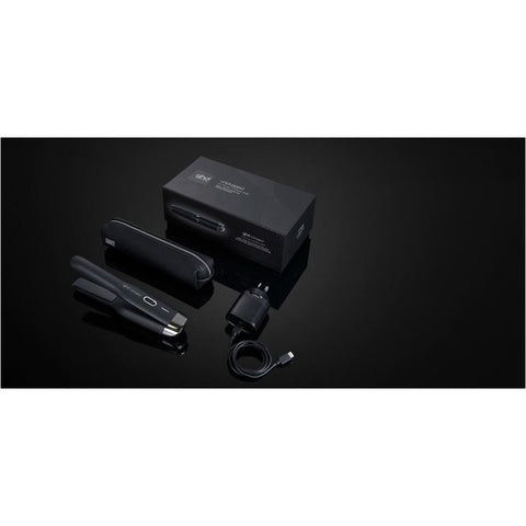 GHD Unplugged black straightener with sleek design, ceramic plates, and compact size for easy styling.