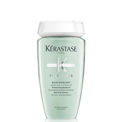 Kérastase Spécifique Bain Divalent scalp shampoo bottle in white, 250ml, with sleek packaging and product label visible.