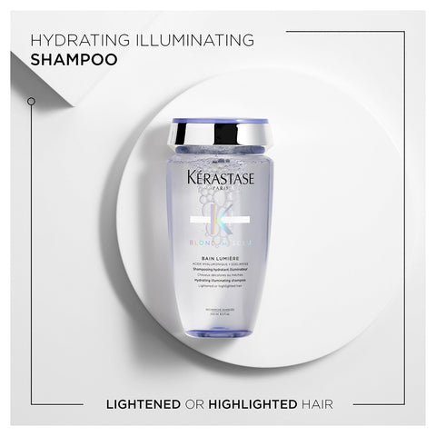 Kérastase Blond Bain Lumiere shampoo bottle in a sleek, white container with a pump dispenser for blonde hair care.
