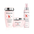 Kérastase Genesis anti-hair fall bundle for medium to thick hair, featuring shampoo and treatment bottles with sleek packaging.