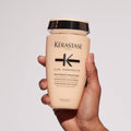 Kérastase Curl Manifesto Bundle featuring Curl Bain shampoo and styling products for curly hair care.