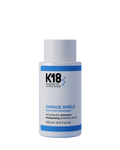 K18 Damage Shield protective bundle featuring K18 pH Protective Shampoo in an 8.5oz blue bottle for damaged hair care.