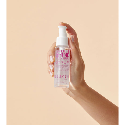 Eleven Australia Smooth & Shine Anti-Frizz Serum bottle, 60ml, with a sleek design and clear label for frizz control.
